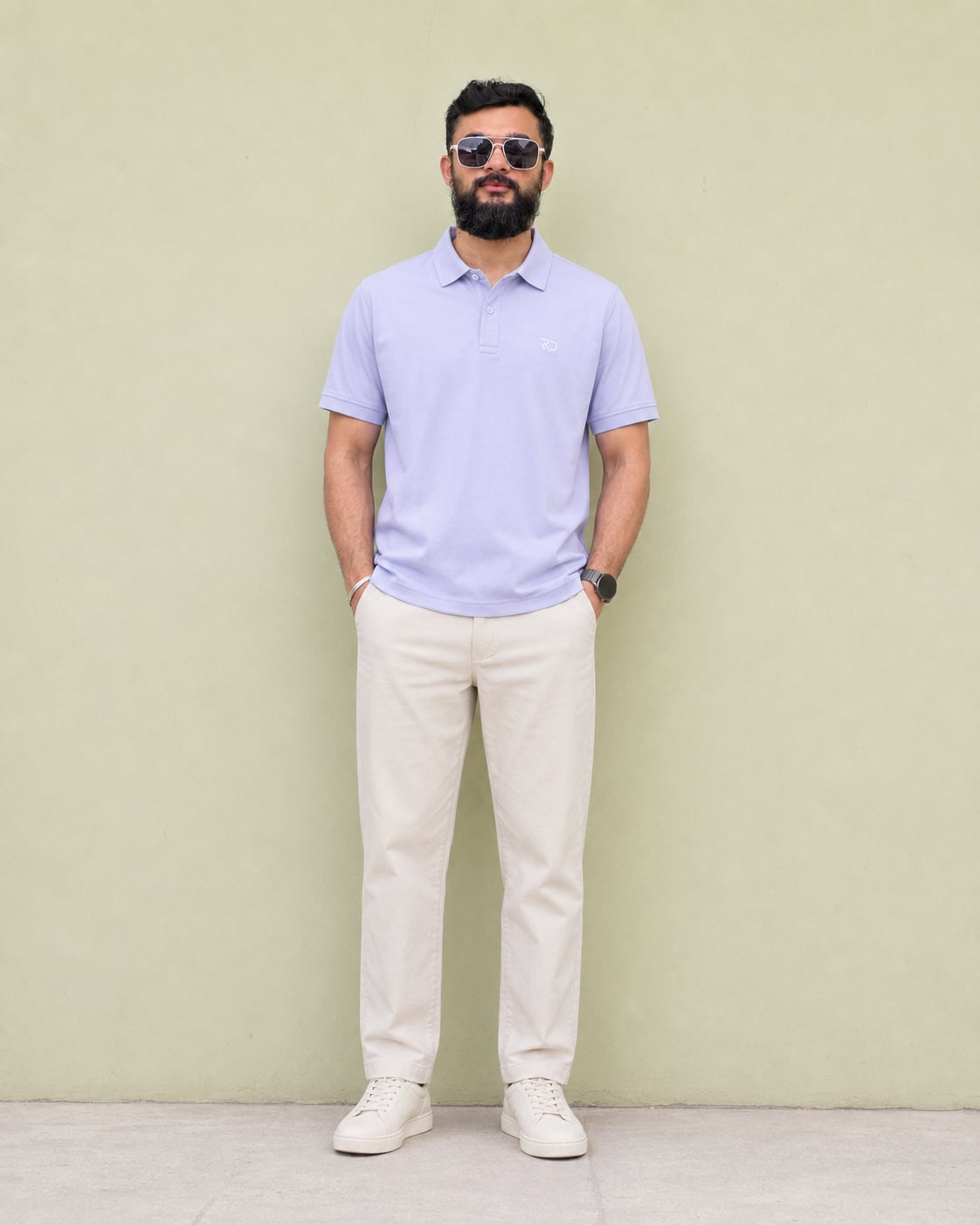 Model wearing the Royal Demin Light Grey Polo with the Ivory Drawstring Linen Pants